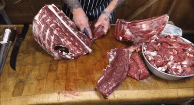 Person Cutting Large Meat Piece GIF