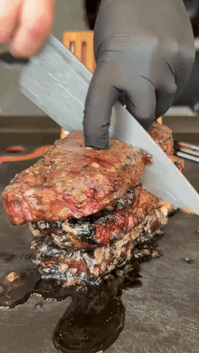 Person Cutting Meat With Knife GIF
