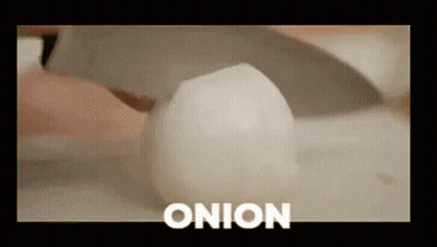 Person Cutting Onion GIF