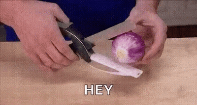 Person Cutting Onion GIF