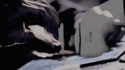 Person Cutting Paper With Knife GIF