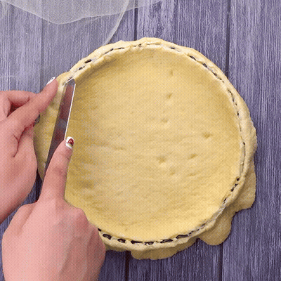 Person Cutting Pie Crust With Knife GIF