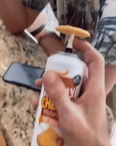 Person Cutting Trentino Cheese On Cutting Board GIF