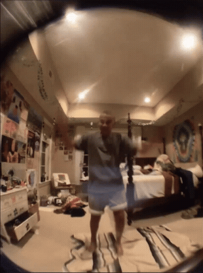 Person Dancing In Bedroom With Bed And Dresser GIF