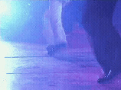 Person Dancing In Dark Room With Purple Lights GIF