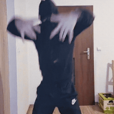 Person Dancing In Front Of Door With Somersby Bananas Box GIF