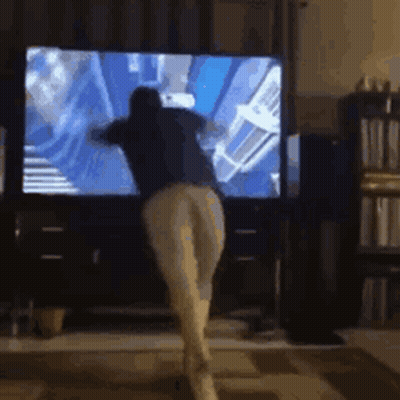 Person Dancing In Front Of TV GIF