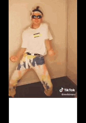 Person Dancing In White Shirt And Tie Dye Pants Sticker