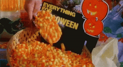 Person Dipping French Fries Into Candy Corn GIF