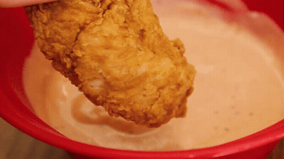 Person Dipping Fried Chicken In Sauce GIF