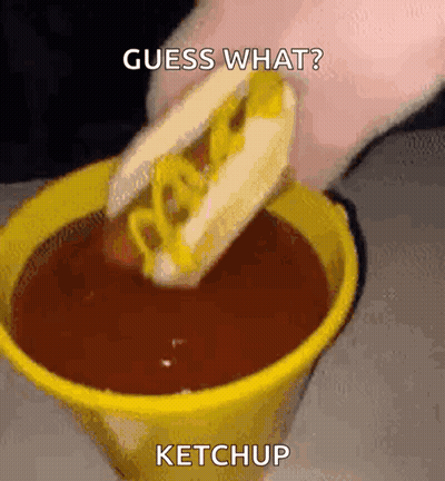 Person Dipping Hot Dog In Ketchup GIF