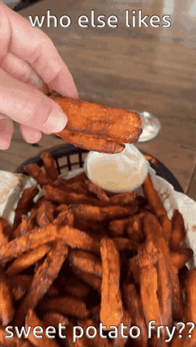Person Dipping Sweet Potato Fry Into Bowl GIF