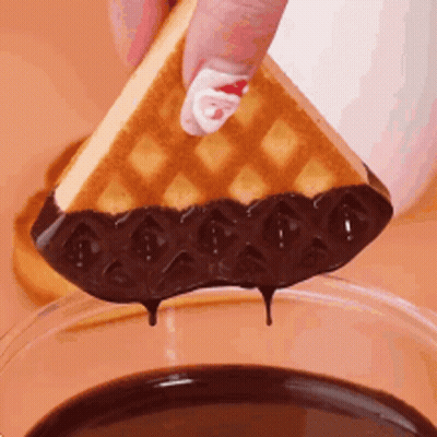Person Dipping Waffle Into Chocolate Sauce GIF