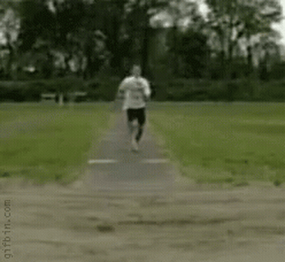 Person Doing Handstand In Dirt In Park GIF