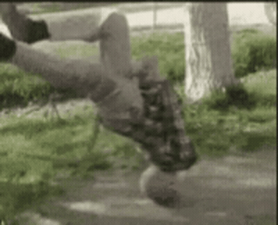 Person Doing Handstand On Skateboard In Park GIF