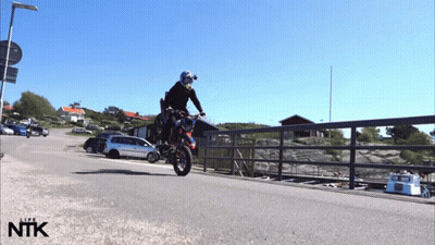 Person Doing Motorcycle Trick With NTK GIF