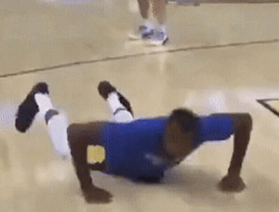 Person Doing Push Ups On Basketball Court GIF
