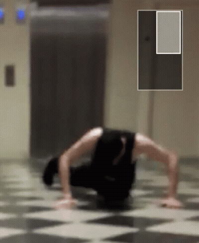 Person Doing Push Ups on Checkered Floor