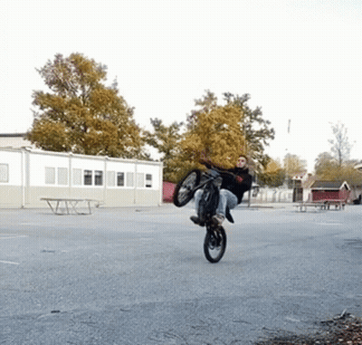 Person Doing Trick On Motorcycle GIF