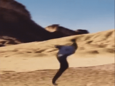 Person Doing Trick On Sand Dune GIF