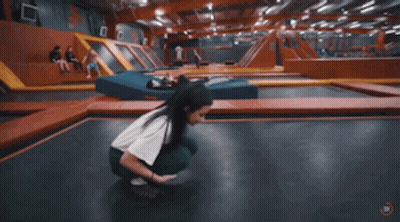 Person Doing Trick On Trampoline GIF