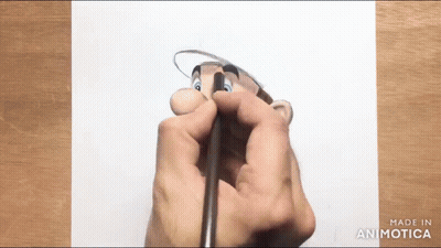 Person Drawing Cartoon Character With Pencil GIF