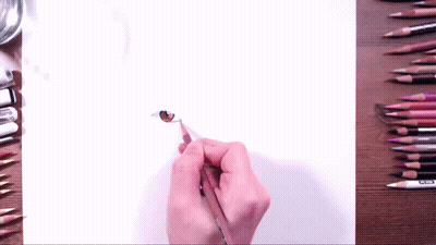 Person Drawing Cat Eye With Brown Pencil GIF