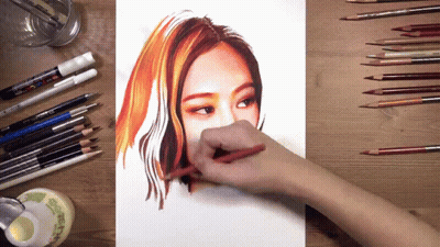 Person Drawing Woman's Face With Colored Pencils GIF