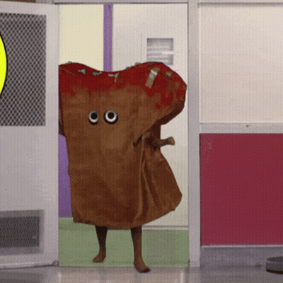 Person Dressed As Pizza With Googly Eyes Walking Through Doorway GIF