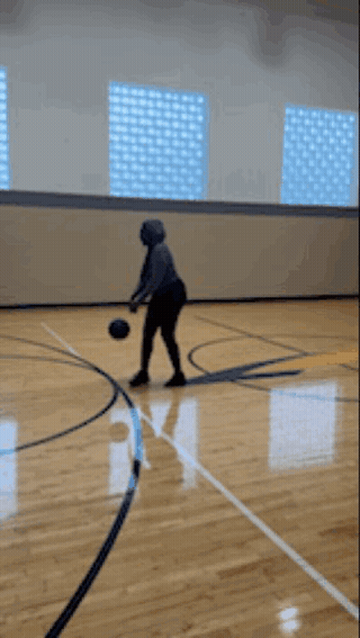 Person Dribbling Basketball GIF
