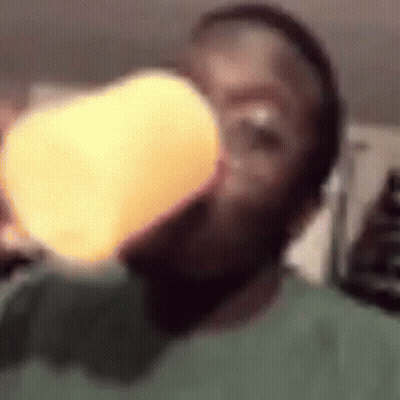 Person Drinking From Cup With Light GIF