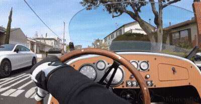 Person Driving Car With Motorcyclist Text GIF