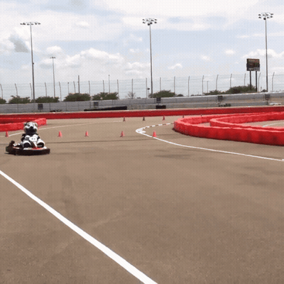 Person Driving Go Kart Down Track GIF