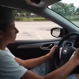 Person Driving Nissan Car GIF