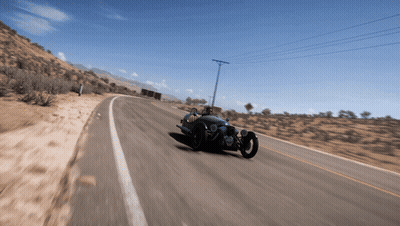 Person Driving Three-Wheeled Vehicle On Desert Road GIF
