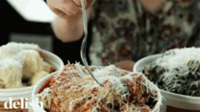 Person Eating Bowl Of Food With Fork Saying Delish GIF
