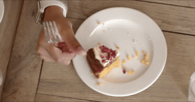 Person Eating Cake On Plate GIF