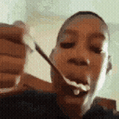 Person Eating Food With Spoon GIF