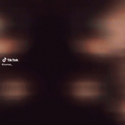 Person Face Close-Up With TikTok Logo GIF