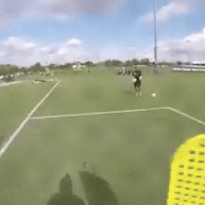 Person Flying Frisbee On Soccer Field GIF