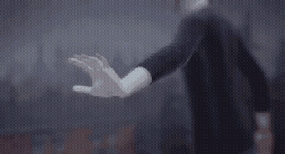 Person Flying Over Building GIF
