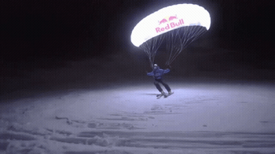 Person Flying Parachute That Says Red Bull GIF