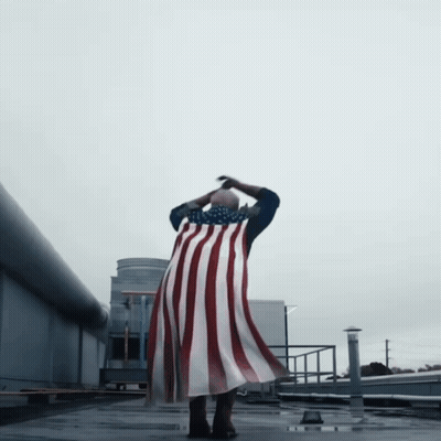 Person Flying With American Flag Cape GIF