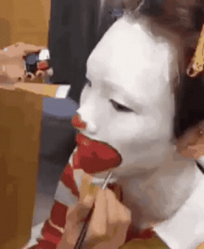 Person Getting Clown Face Paint GIF