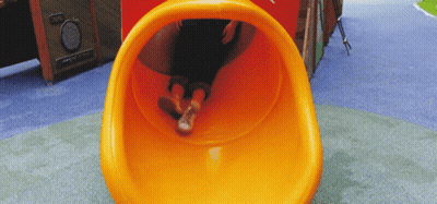 Person Going Down Orange Slide GIF