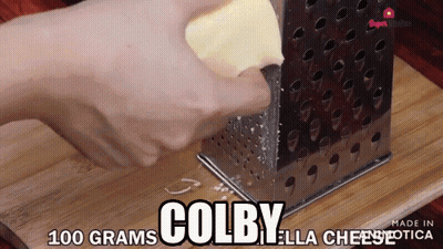 Person Grating Cheese Saying Colby Ella Cheese GIF