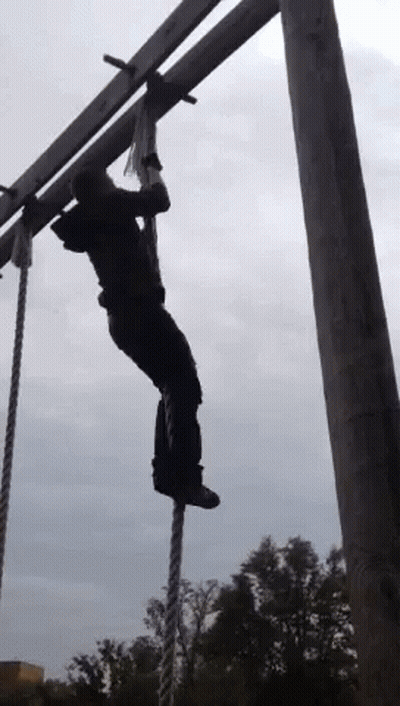 Person Hanging From Rope In Sky GIF