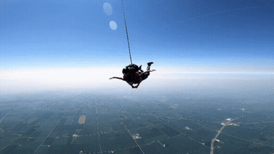 Person Hanging From Rope GIF