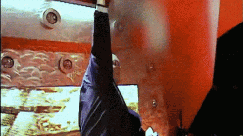 Person Hanging Upside Down In Red Room GIF