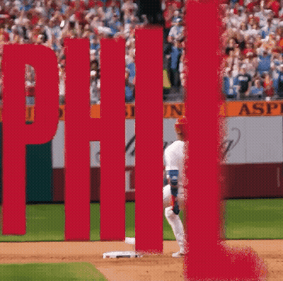 Person Hanging Upside Down Next To Red Stop Sign GIF